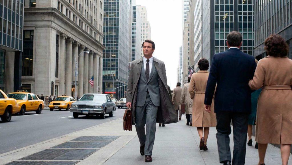 A confident individual walking steadily through a modern urban environment, slightly out of focus crowd moving around them, while they remain calm and composed. The lighting highlights their face and posture, symbolizing quiet confidence and consistency. Subtle motion blur in the background, sharp focus on the subject, neutral tones, cinematic realism, inspirational mood, no text, no logos.