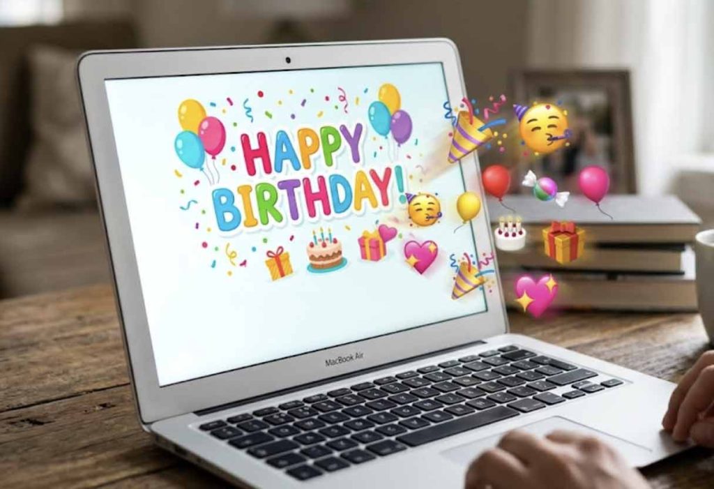 A laptop screen displaying a digital birthday greeting, with colorful emojis dynamically popping out of the screen.