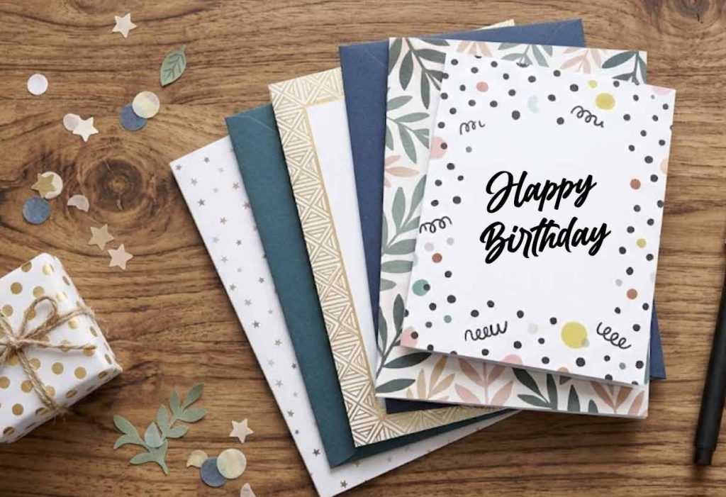 Birthday Cards stacked on top of each other on a wooden table